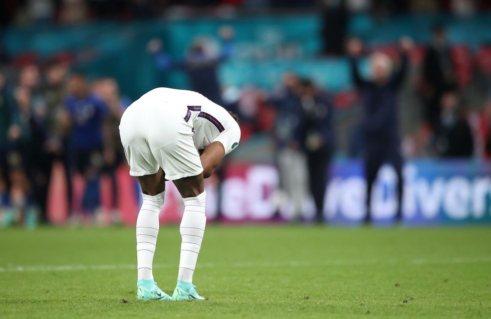 England's Marcus Rashford reacts after missing in the penalty shoot-out during the UEFA Euro 2020 Final at Wembley Stadium