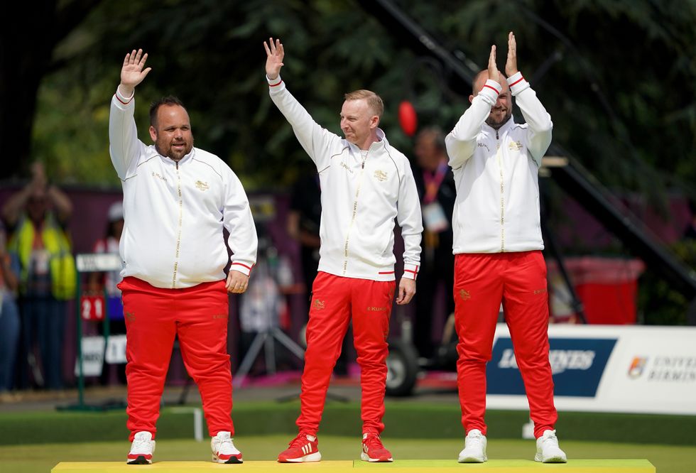 England's Nick Brett, Louis Ridout and Jamie Chestney celebrate winning gold following the Men's Triples - Gold Medal Match at Victoria Park on day four of the 2022 Commonwealth Games in Birmingham. Picture date: Monday August 1, 2022.