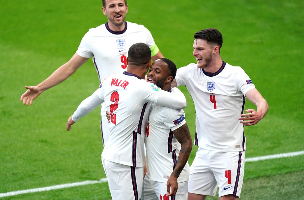 England's Raheem Sterling (centre) celebrates scoring their side's first goal of the game with Kyle Walker (left), Harry Kane and Declan Rice (right) during the UEFA Euro 2020 Group D match at Wembley Stadium, London. Picture date: Tuesday June 22, 2021.