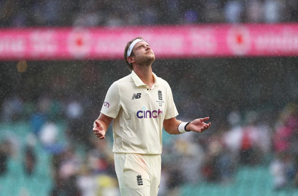England's Stuart Broad walks off in the rain at the close of play during day one of the fourth Ashes test at the Sydney Cricket Ground, Sydney. Picture date: Wednesday January 5, 2022.