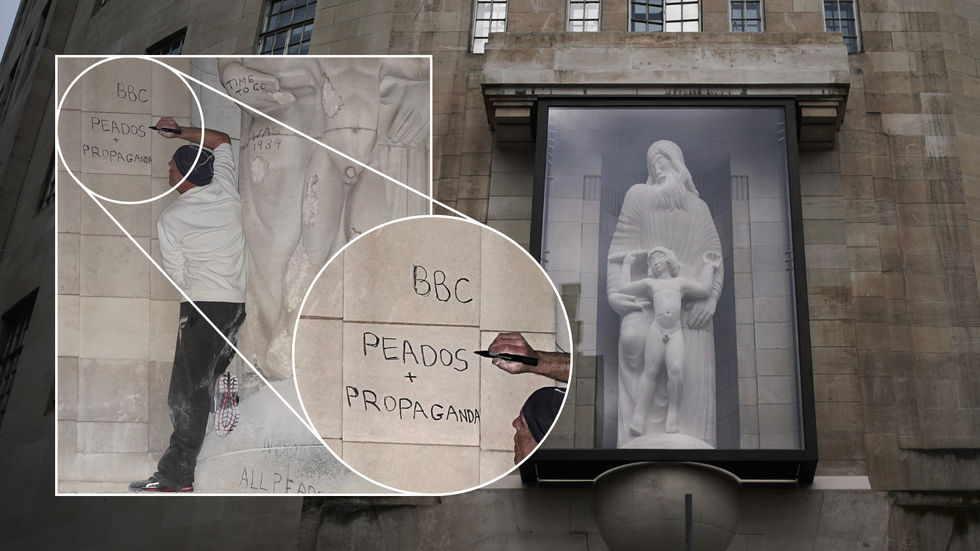Eric Gill statue/Man climbs on Eric Gill statue