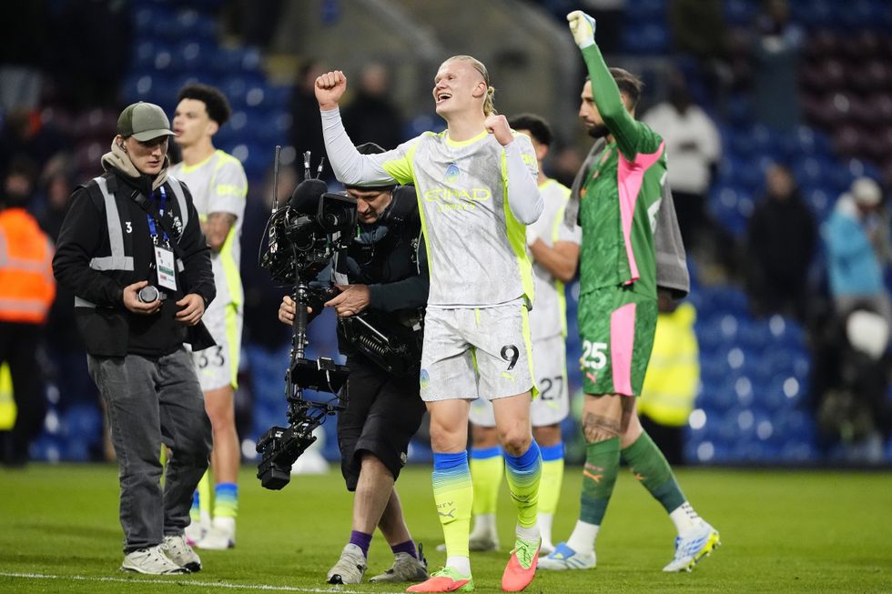 Erling Haaland celebrates with his Man City teammates following their win over Burnley
