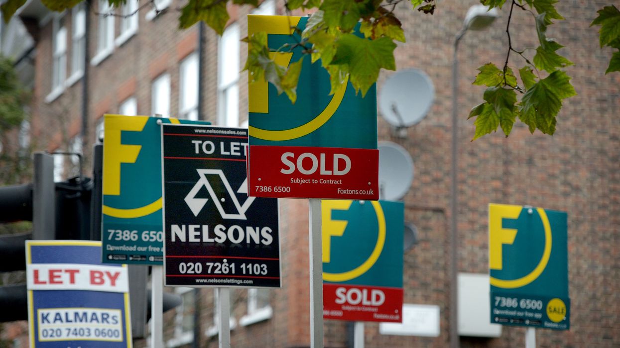 Estate agents signs outside flats on the Old Kent Road in London