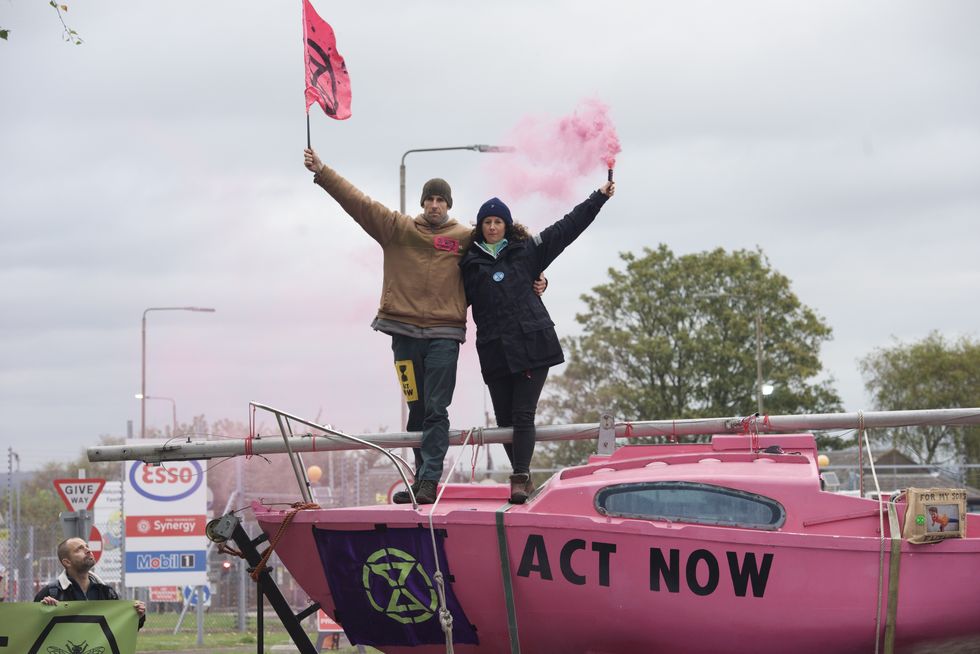 Etienne Stott (left) is seen at an Extinction Rebellion protest in 2021.