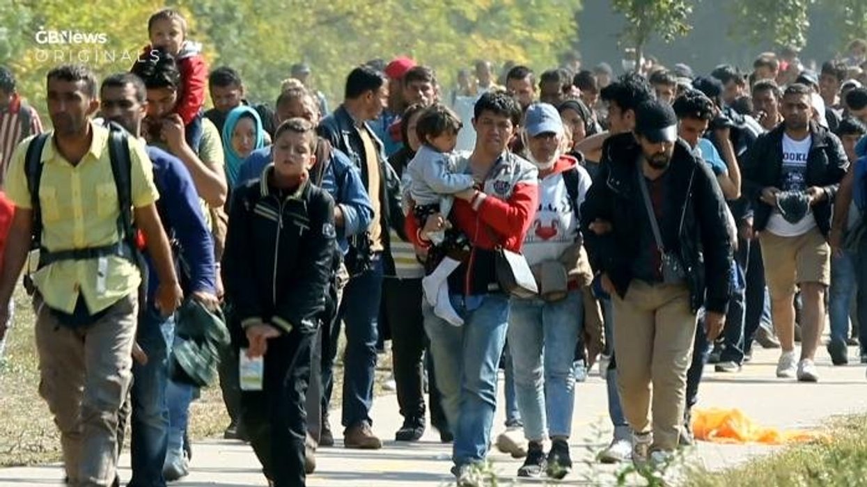 Massive queues pile up at registry offices in Spain after socialist PM hands 500,000 migrants legal status