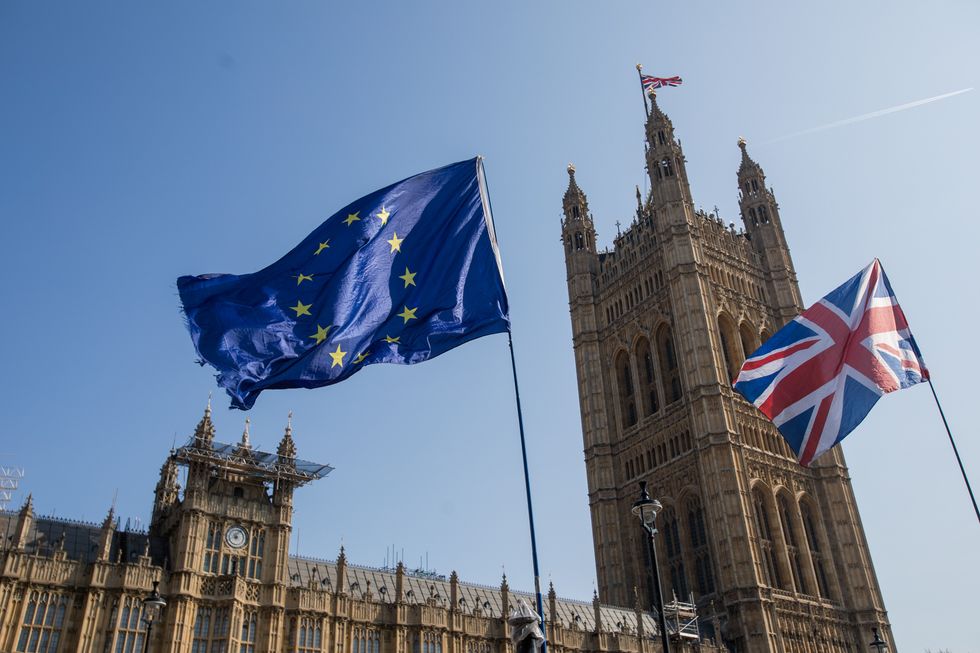 European and British flags outside Parliament