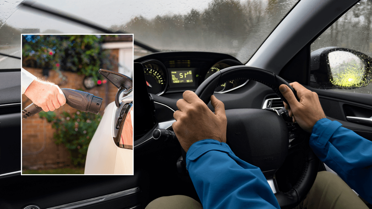 EV charger and driver in car in rain
