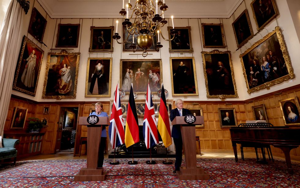 Ex-Prime Minister Boris Johnson and the former Chancellor of Germany, Angela Merkel, during a press conference after their meeting at Chequers
