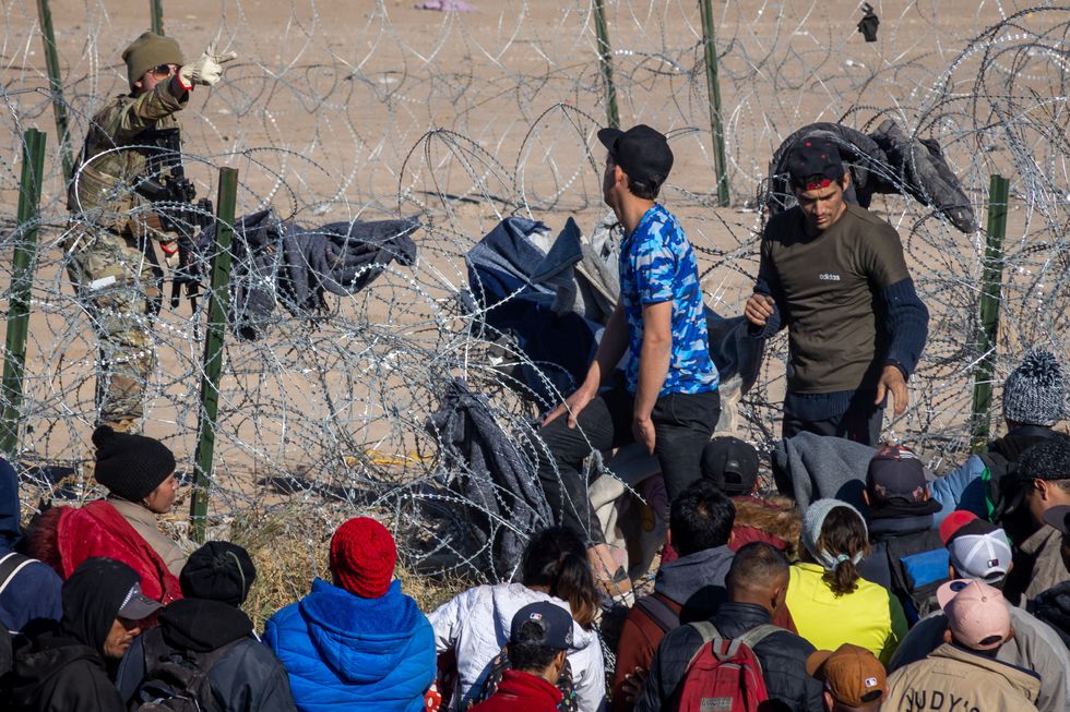 exas National Guard take security measures as hundreds of migrants are attempting to reach the United States border