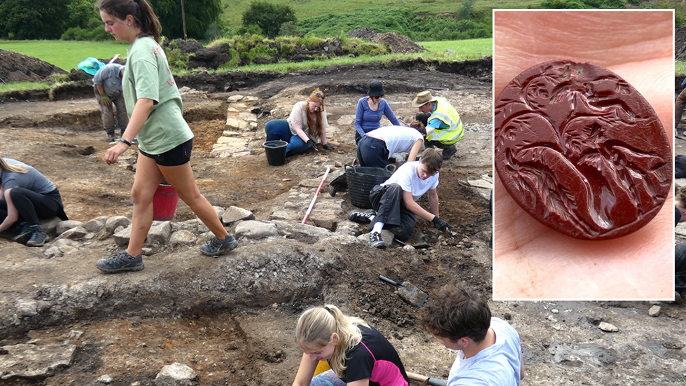 Excavators dig the site