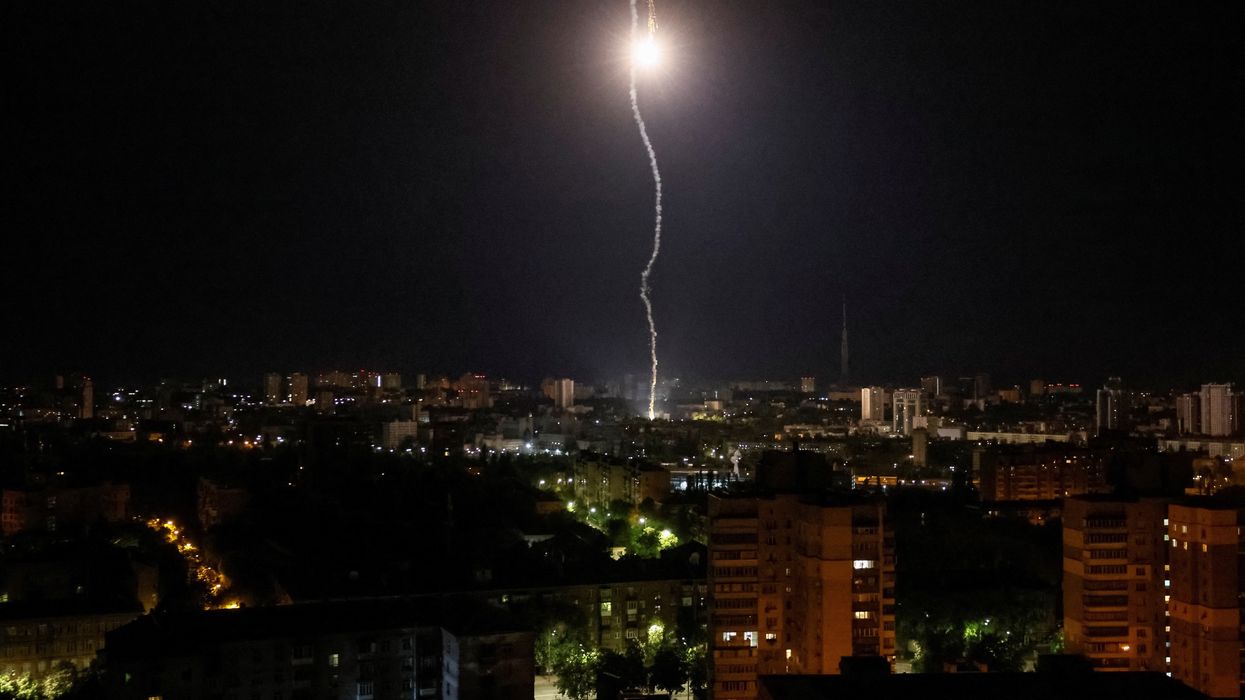 Explosion of a missile is seen in the sky over the city during a Russian missile strike