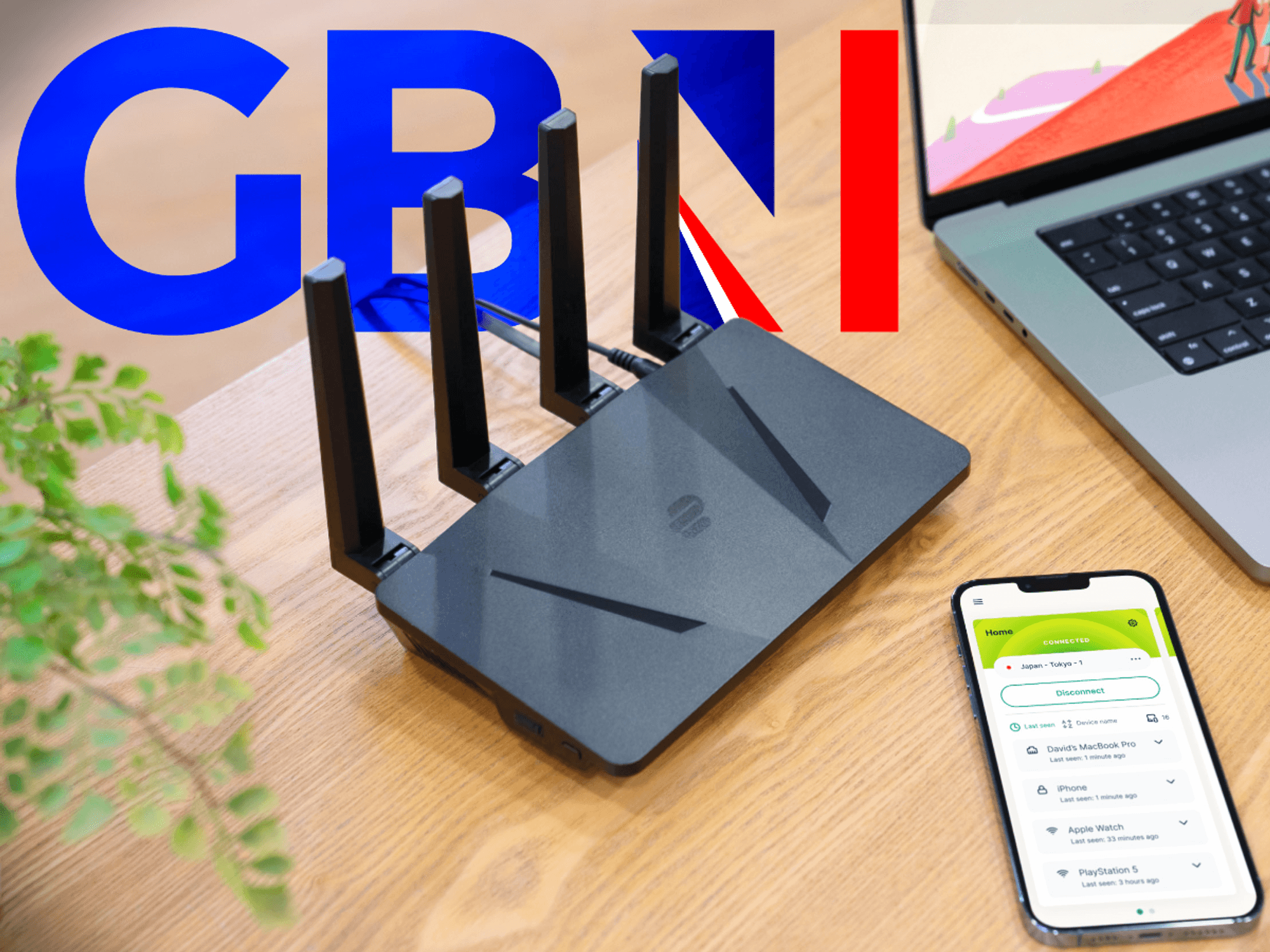 ExpressVPN Wi-Fi router pictured on a desk next to a laptop and iPhone running the app