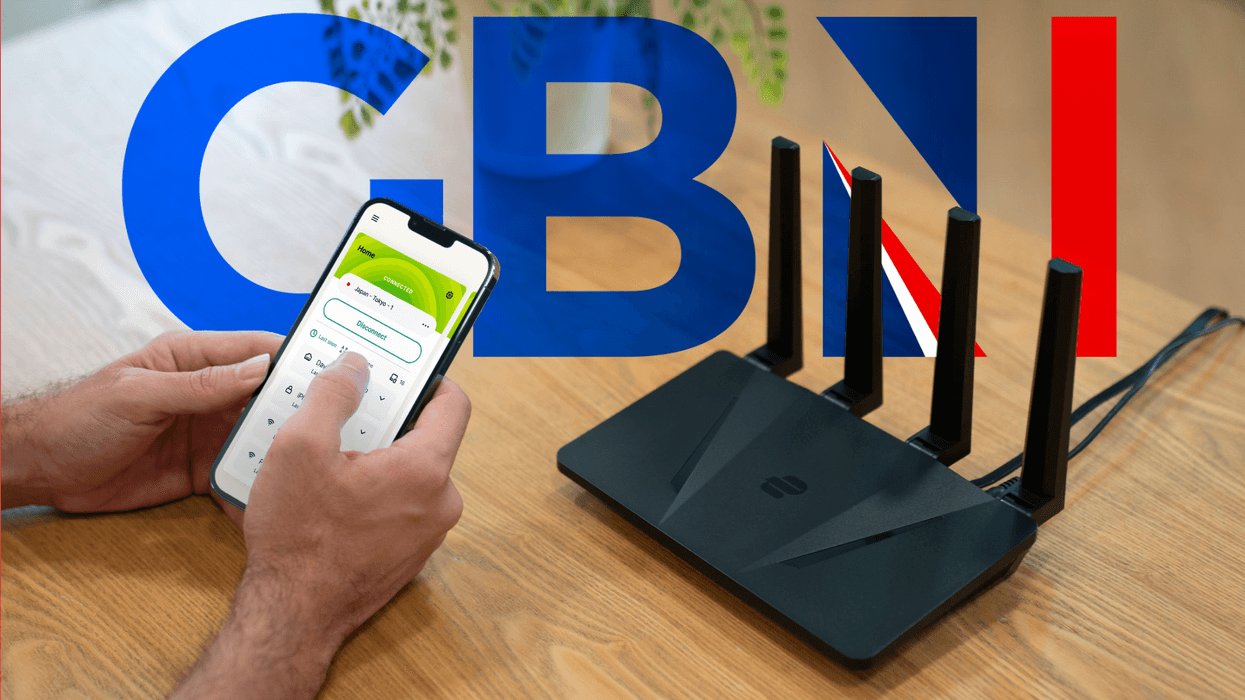 ExpressVPN Wi-Fi router pictured on a desk next to a laptop and iPhone running the app