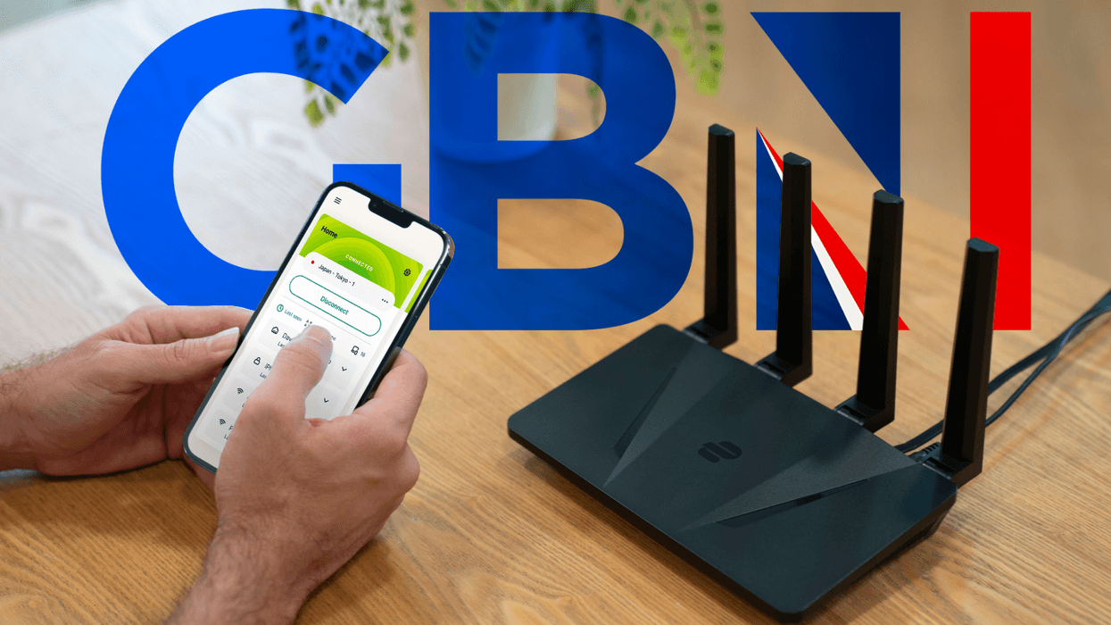 ExpressVPN Wi-Fi router pictured on a desk next to a laptop and iPhone running the app