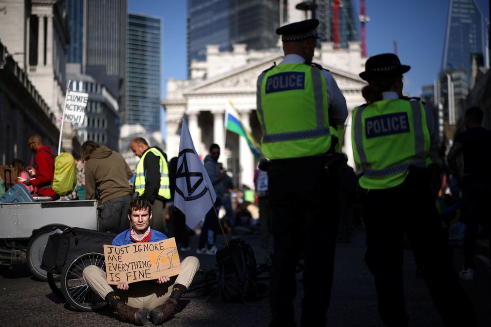 Extinction Rebellion climate activists protest outside the Bank of England in London