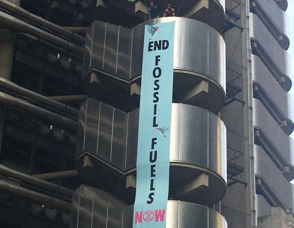 Extinction Rebellion protesters said people have scaled the Lloyd's of London building and unfurled banners