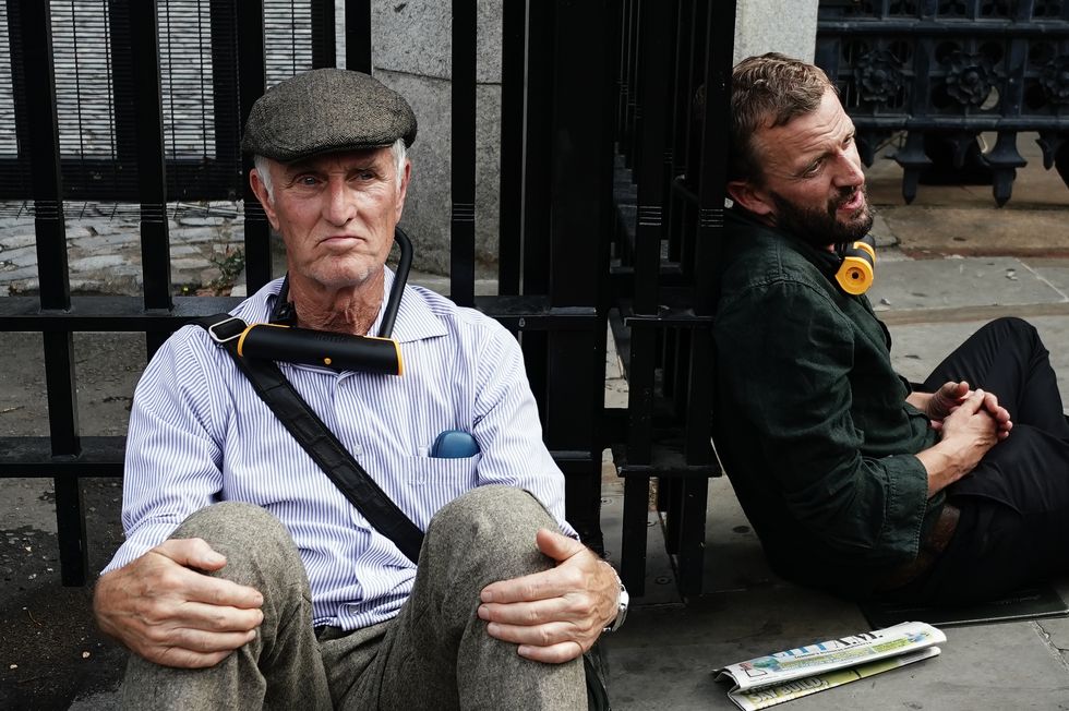 Extinction Rebellion protesters, who have padlocked their necks to the railings, outside the Houses of Parliament, Westminster, calling for a Citizen's assembly. The campaign group says supporters have also superglued themselves around the Speaker's chair in the House of Commons chamber. Picture date: Friday September 2, 2022.