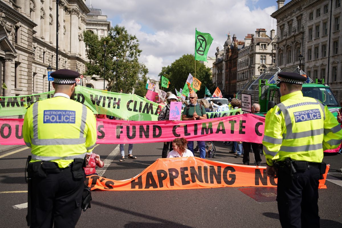 Extinction Rebellion protests congregating outside the offices of HM Revenue and Customs in 2021