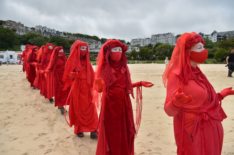 Extinction Rebellion Red Rebels during an XR Protest in St Ives.