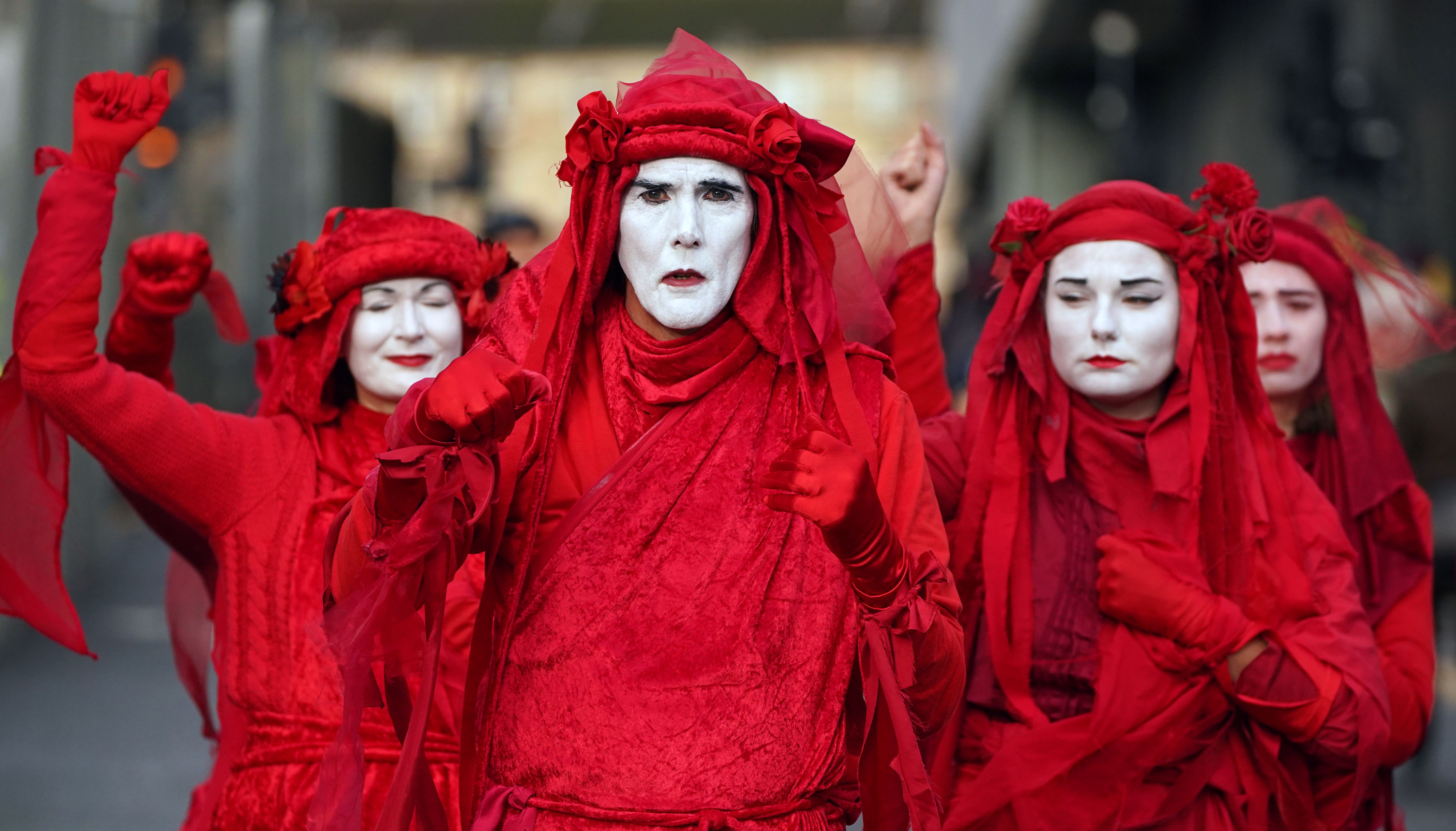 Extinction Rebellion Red Rebels during the official final day of the Cop26 summit in Glasgow. Picture date: Friday November 12, 2021.