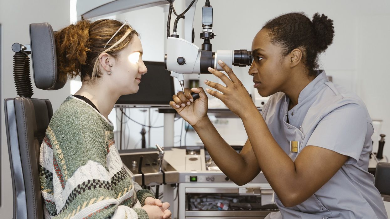 Eye doctor examining patient