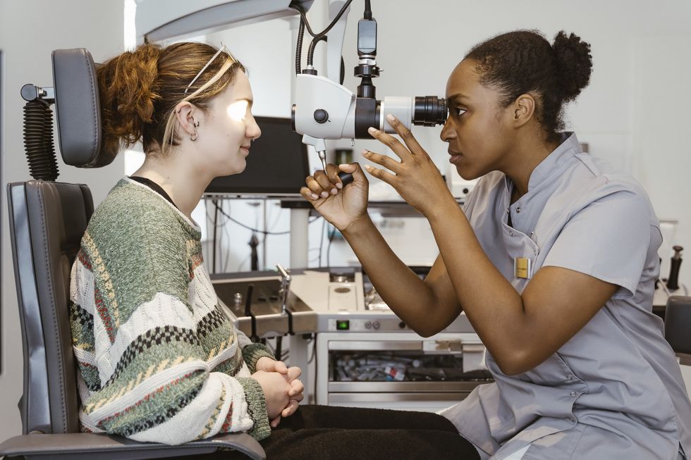 Eye doctor examining patient