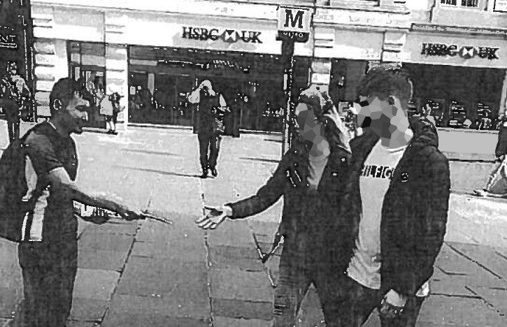 Ezedi handing out leaflets