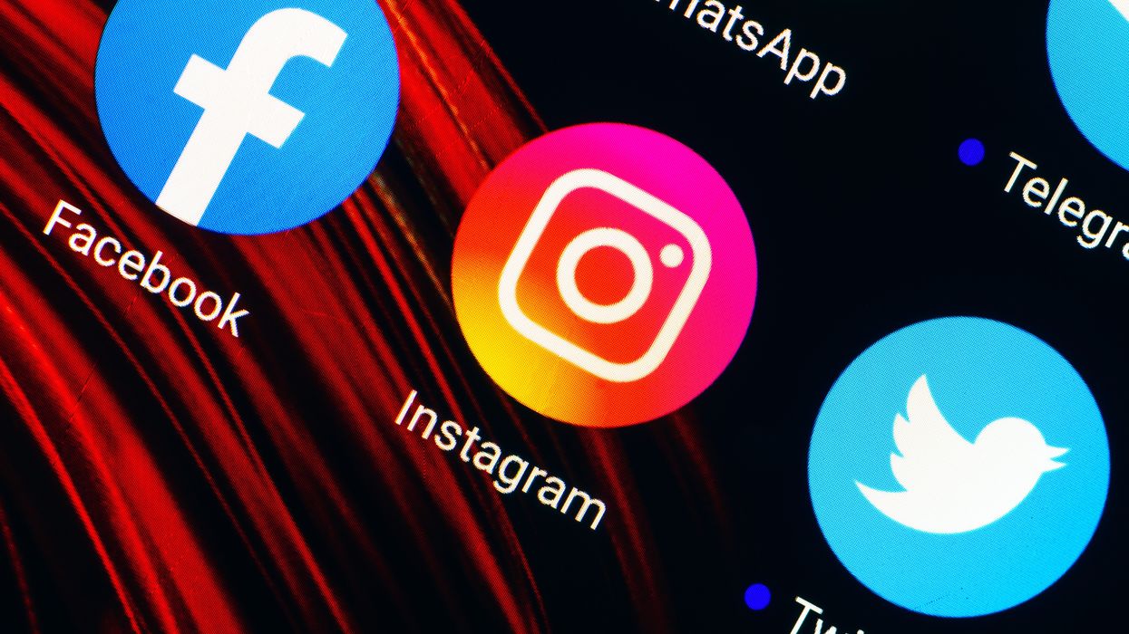 facebook instagram and twitter app icons are pictured on a smartphone screen