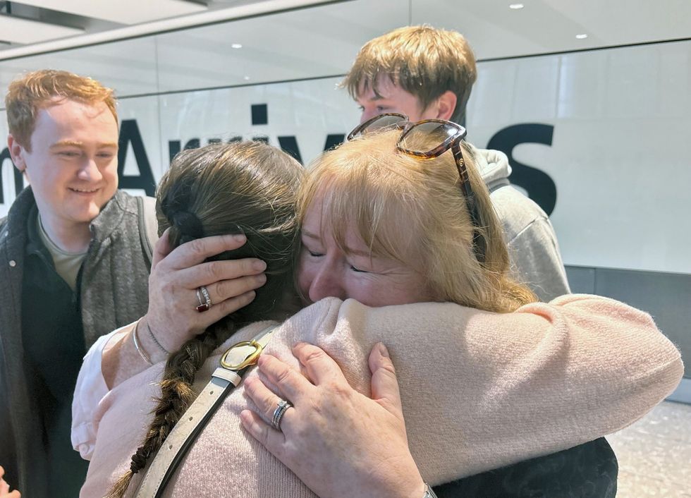Families reuniting after evacuation flight