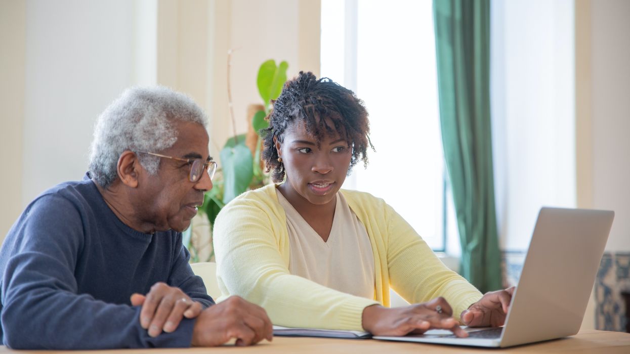 Family looking at laptop