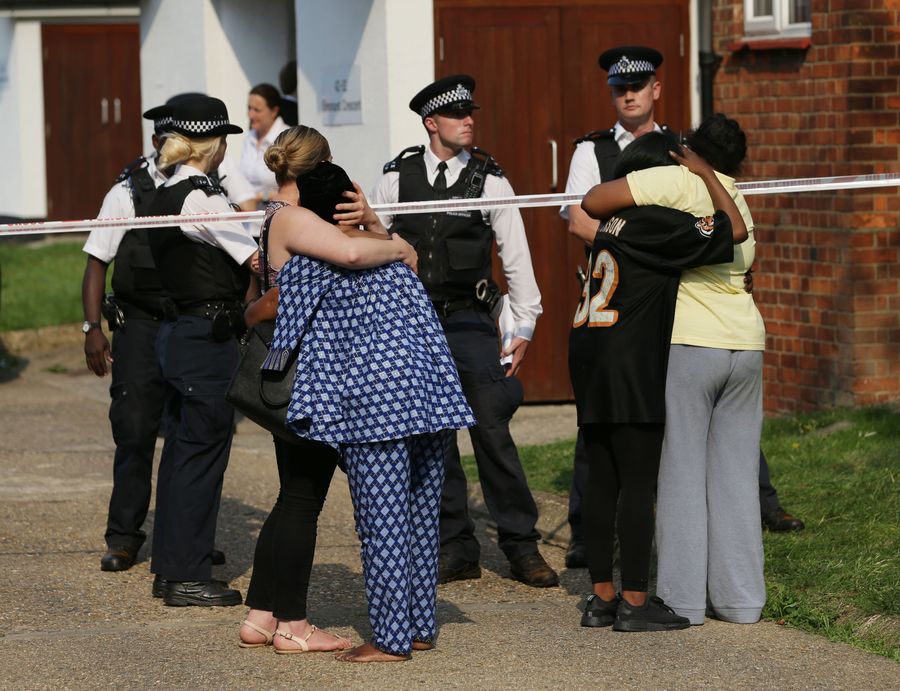 Family mourning outside East Finchley flat