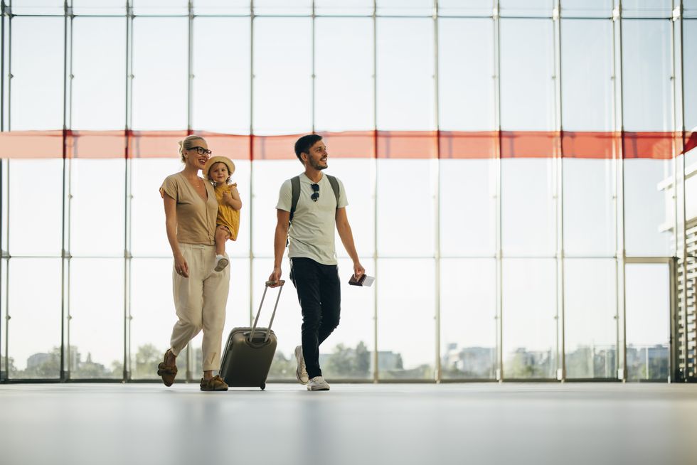 Family walking through airport