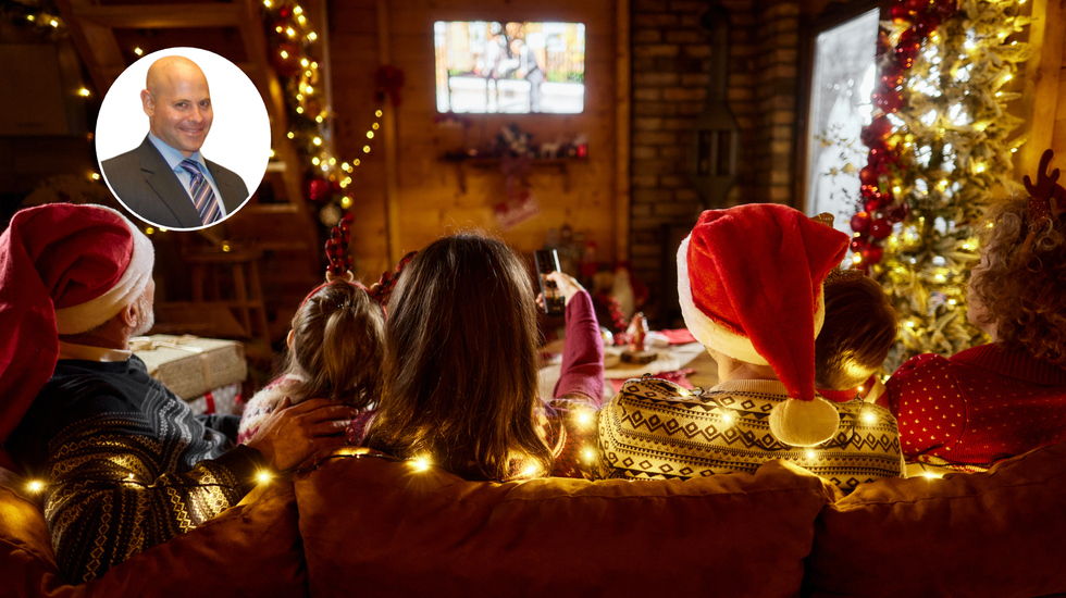Family watching TV at Christmas