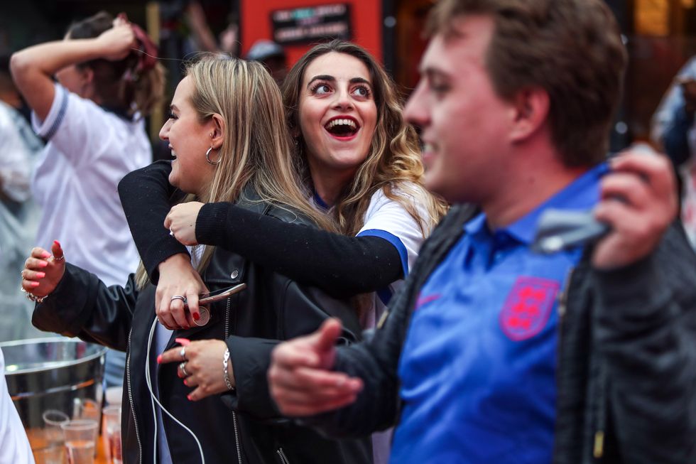 Fans celebrate during the UEFA Euro 2020 round of 16 match between England and Germany at the Vinegar Yard pub in London. Picture date: Tuesday June 29, 2021.