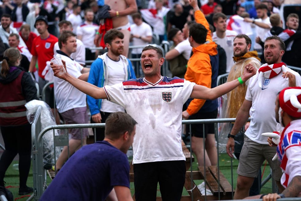 Fans in Manchester celebrate in the fan zone during the Euro 2020 quarter final match between England and Ukraine. Picture date: Saturday July 3, 2021.