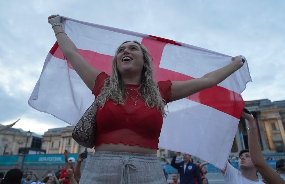 Fans in Trafalgar Square, London, celebrate as England beat Ukraine 4-0 in their Euro2020 quarter final match. Picture date: Saturday July 3, 2021.