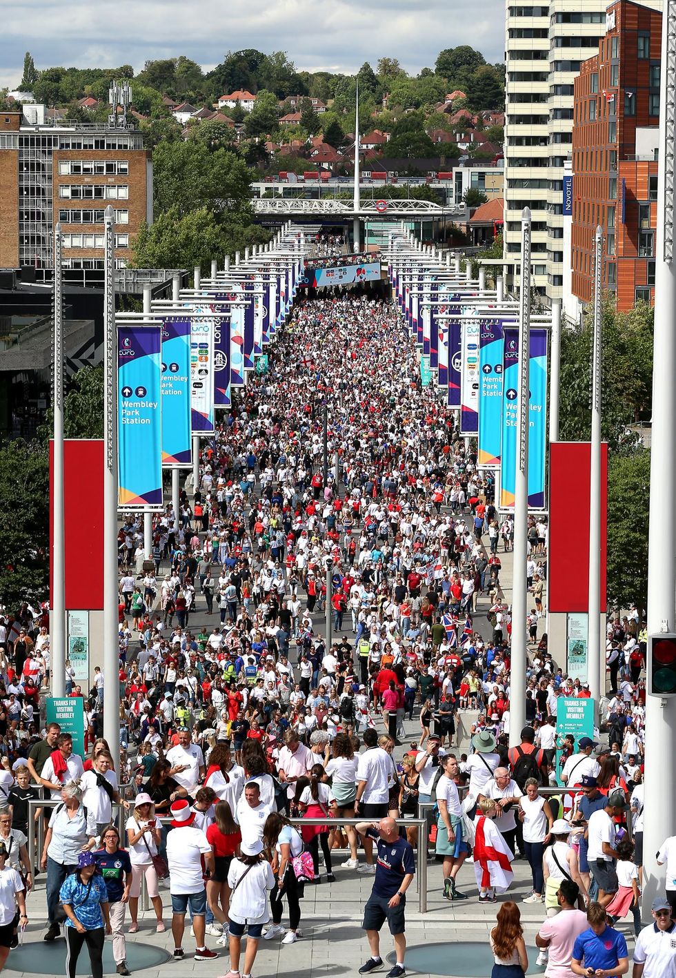 Fans make their way to the stadium before the UEFA Women's Euro 2022 final at Wembley Stadium, London