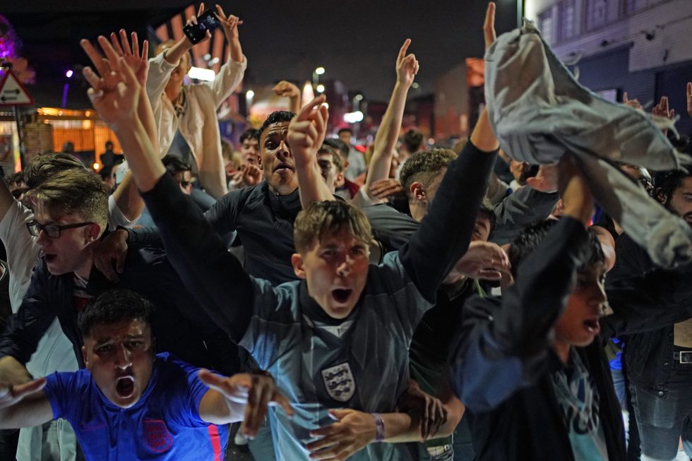 Fans on the streets in Birmingham celebrate England qualifying for the Euro 2020 final after watching the Euro 2020 semi final match between England and Denmark. Picture date: Wednesday July 7, 2021.