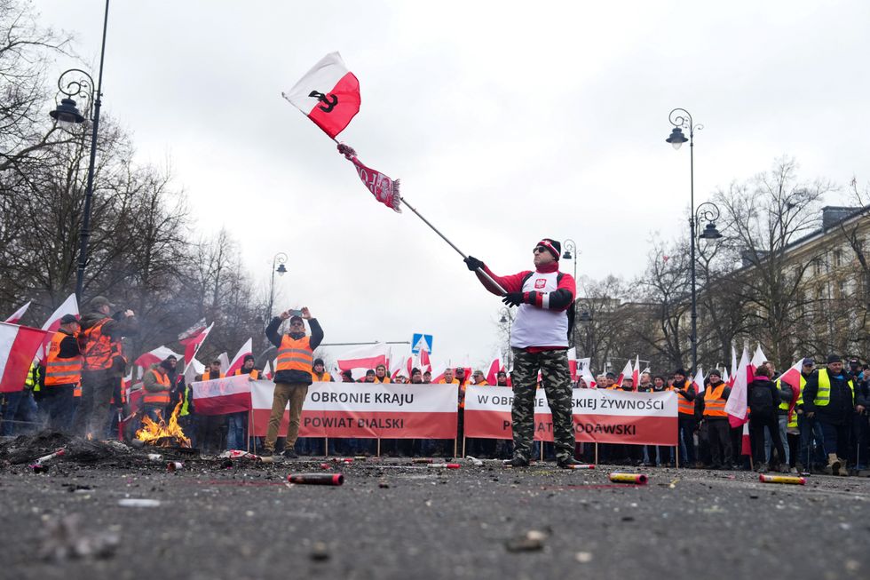 Farmers take part in a protest outside Polish Prime Minister Donald Tusk's office