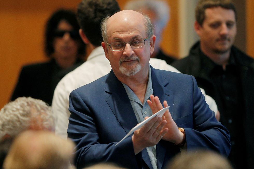 FILE PHOTO: Author Salman Rushdie arrives for the PEN New England's Song Lyrics of Literary Excellence Award ceremony at the John F. Kennedy Library in Boston, Massachusetts, U.S. September 19, 2016. REUTERS/Brian Snyder/File Photo