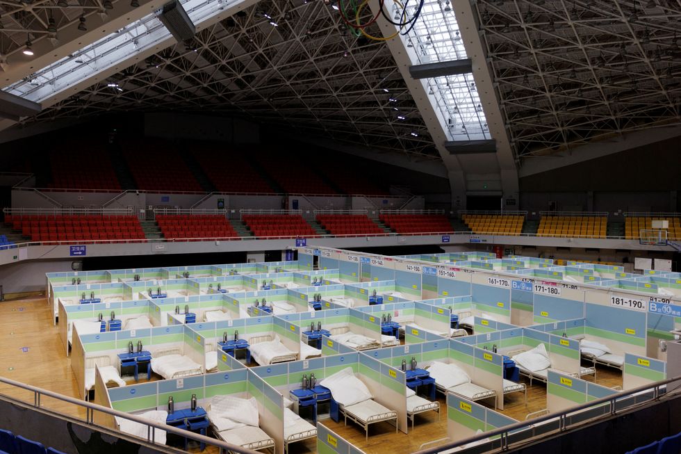 FILE PHOTO: Beds are seen in a fever clinic that was set up in a sports area as coronavirus disease (COVID-19) outbreaks continue in Beijing, December 20, 2022. REUTERS/Thomas Peter/File Photo
