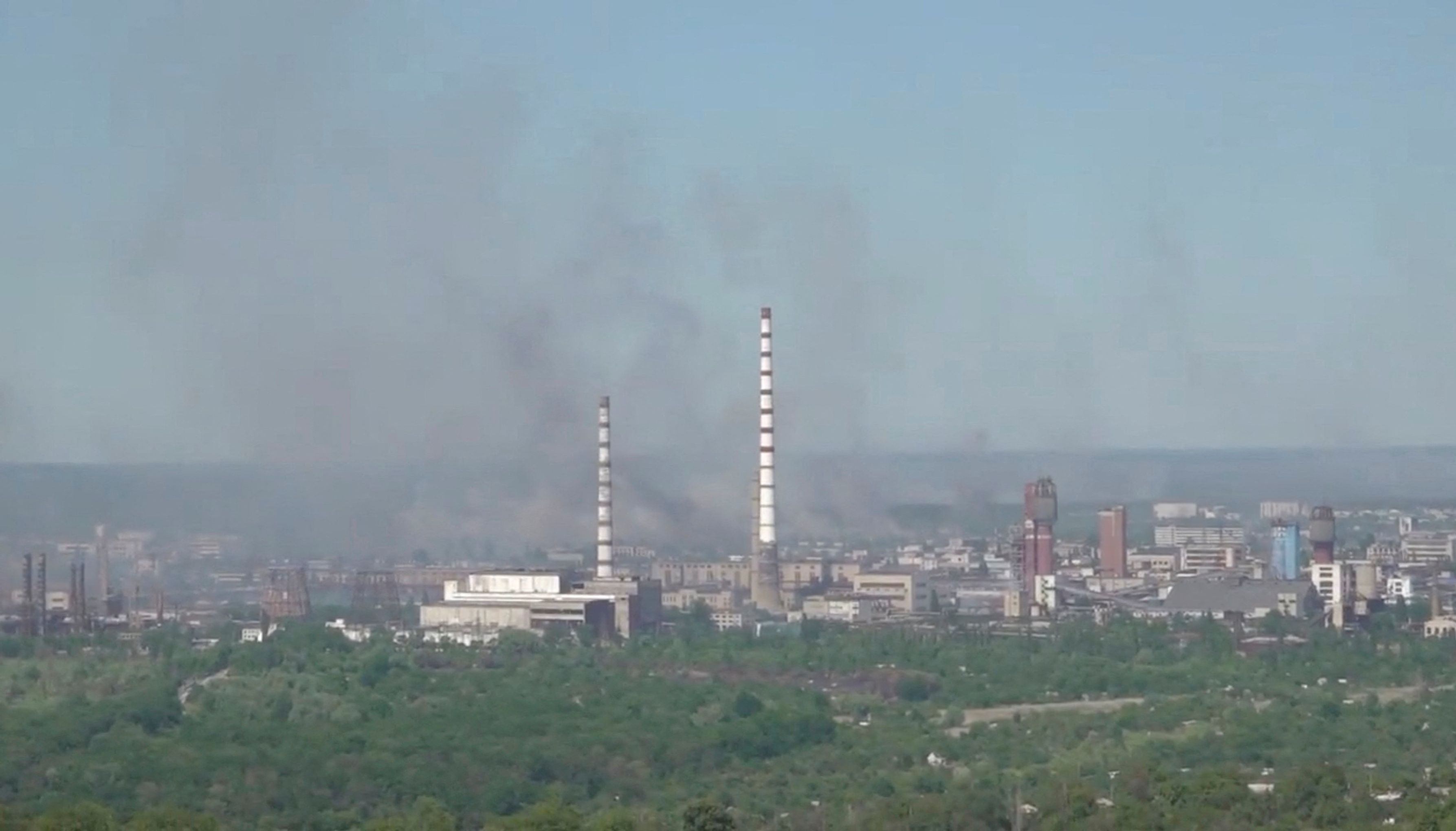 FILE PHOTO: Black smoke billows over Sievierodonetsk Azot chemical plant as Russia's invasion on Ukraine continues, in Sievierodonetsk, Luhansk Region, Ukraine.