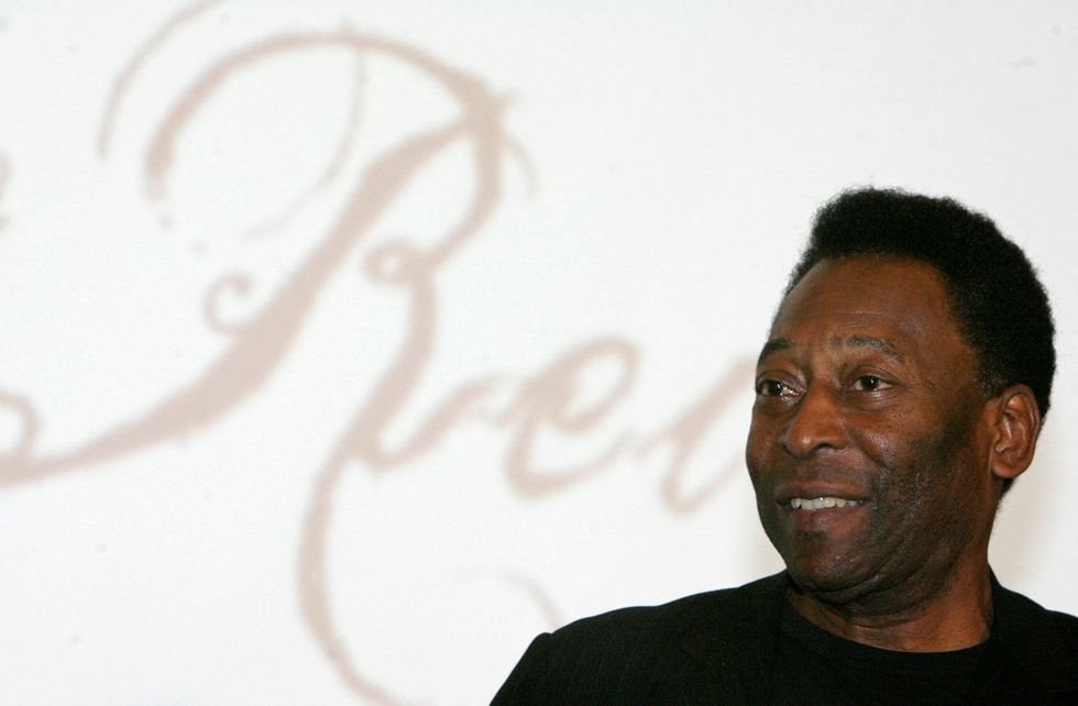 FILE PHOTO: Brazilian soccer legend Pele attends a news conference on an exhibition about his life called %22The Marks of the King%22, which is being held in conjunction with celebrations commemorating the 50th anniversary of Brazil's World Cup victory, at the National Museum in Brasilia, Brazil, June 25, 2008. REUTERS/Roberto Jayme/File Photo