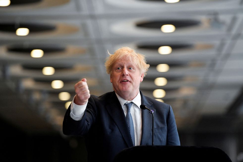 FILE PHOTO: British Prime Minister Boris Johnson delivers a speech during an engagement to mark the completion of the Elizabeth Line at Paddington Station in London, Britain, May 17, 2022. REUTERS/Toby Melville/File Photo