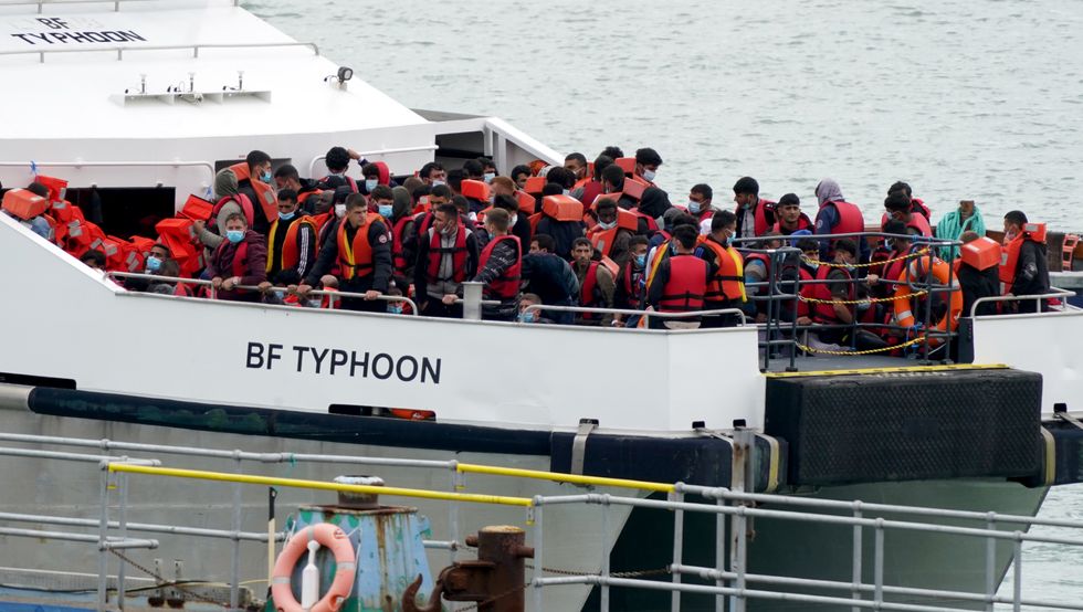 File photo dated 01/08/22 of a group of people thought to be migrants are brought in to Ramsgate, Kent, onboard a Border Force vessel following a small boat incident in the Channel.