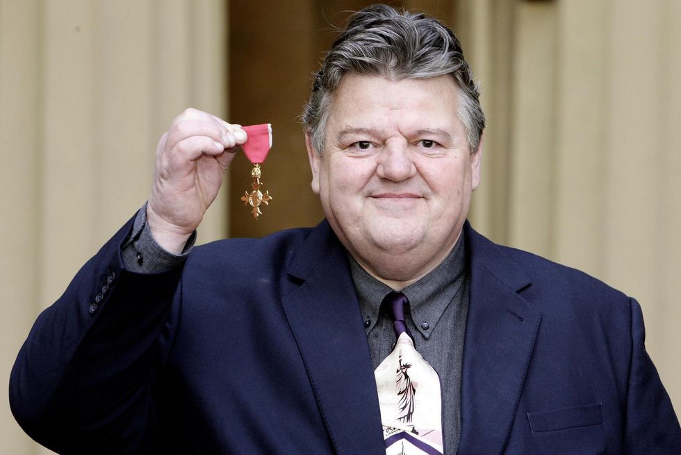 File photo dated 02/03/2006 of Robbie Coltrane with his OBE after receiving it from the Queen at Buckingham Palace, London. The Harry Potter and Cracker actor has died aged 72, his agent has said. Issue date: Friday October 14, 2022.