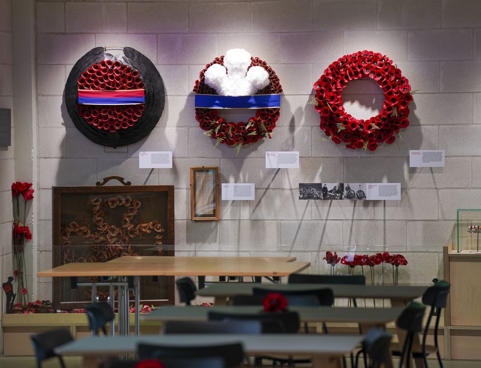 File photo dated 02/03/22 of the wreaths which the Queen, then then Prince of Wales (centre) (now King Charles III) and the then Duke of Cambridge (right) (now the Prince of Wales) lay at the cenotaph are on display in the new visitor centre at the Poppy Factory in Richmond, south west London. The royal family will be out in force on Sunday for a moving Remembrance Day service - the first since the death of the Queen. The King will lay a new poppy wreath incorporating a ribbon of his racing colours, with the design a tribute to the ones used by both his late mother and his grandfather George VI. Issue date: Thursday November 10, 2022.