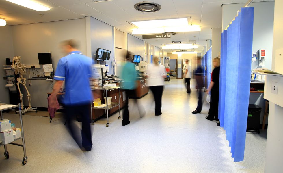 File photo dated 03/10/14 of staff on a NHS hospital ward, as nurses and midwives were forced to take more than 225,000 days off because of mental health issues in the last year, new figures show.
