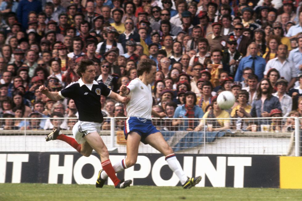 File photo dated 04-06-1977 of Scotland captain Bruce Rioch is chased by England's Ray Kennedy in a match at Wembley. Former Liverpool and Arsenal player Ray Kennedy has died at the age of 70, the Merseyside club have announced. Issue date: Tuesday November 30, 2021.