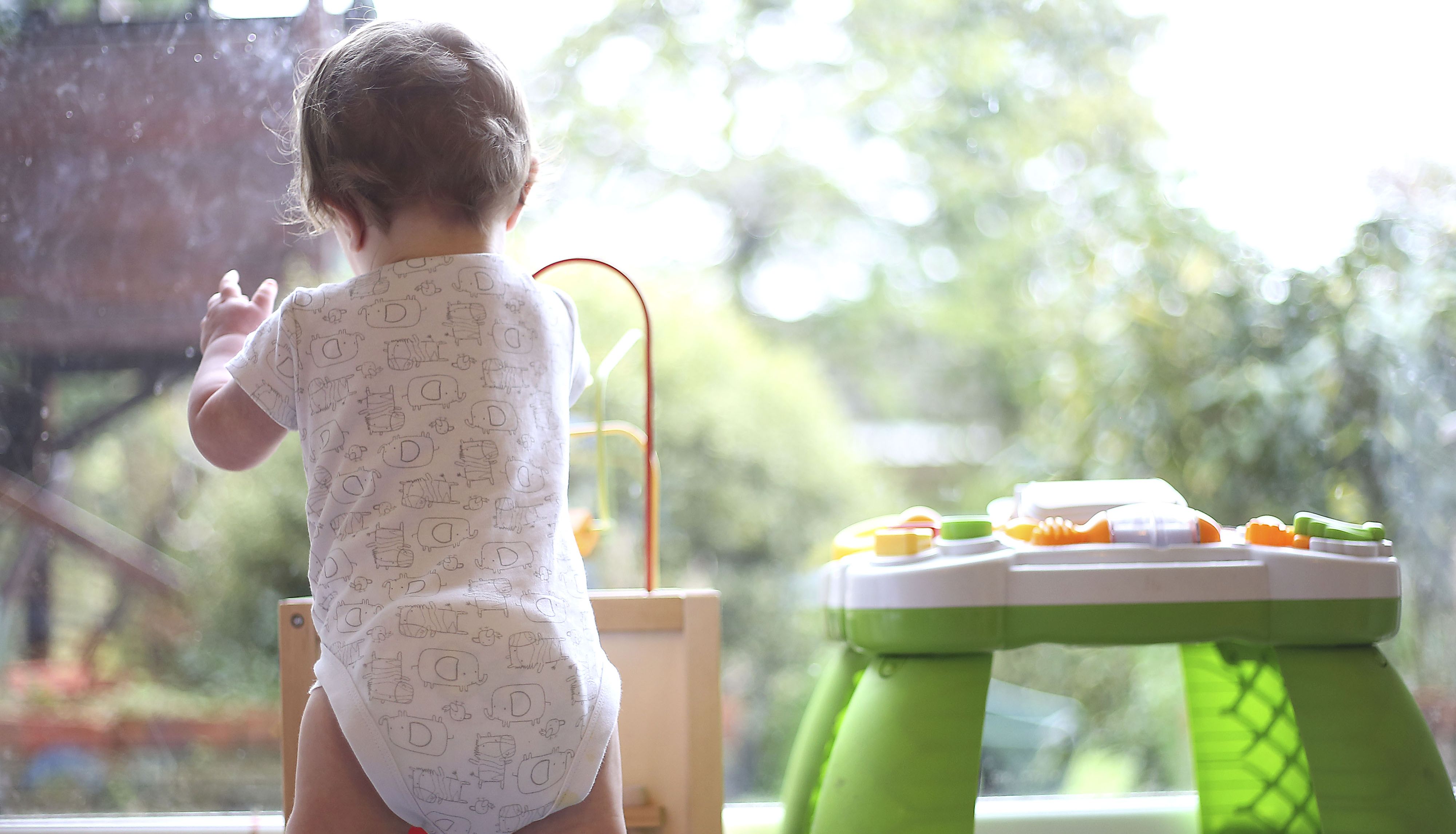 File photo dated 05/02/16 of an eight month old baby boy playing with an activity table. Around two-fifths of families with children at home were already struggling to pay their bills in early April as the cost-of-living crisis deepened, a survey has found. Issue date: Thursday April 21, 2022.